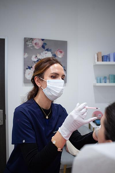 Injectable follow-up visit in Southlake TX with provider assessing results and facial symmetry.