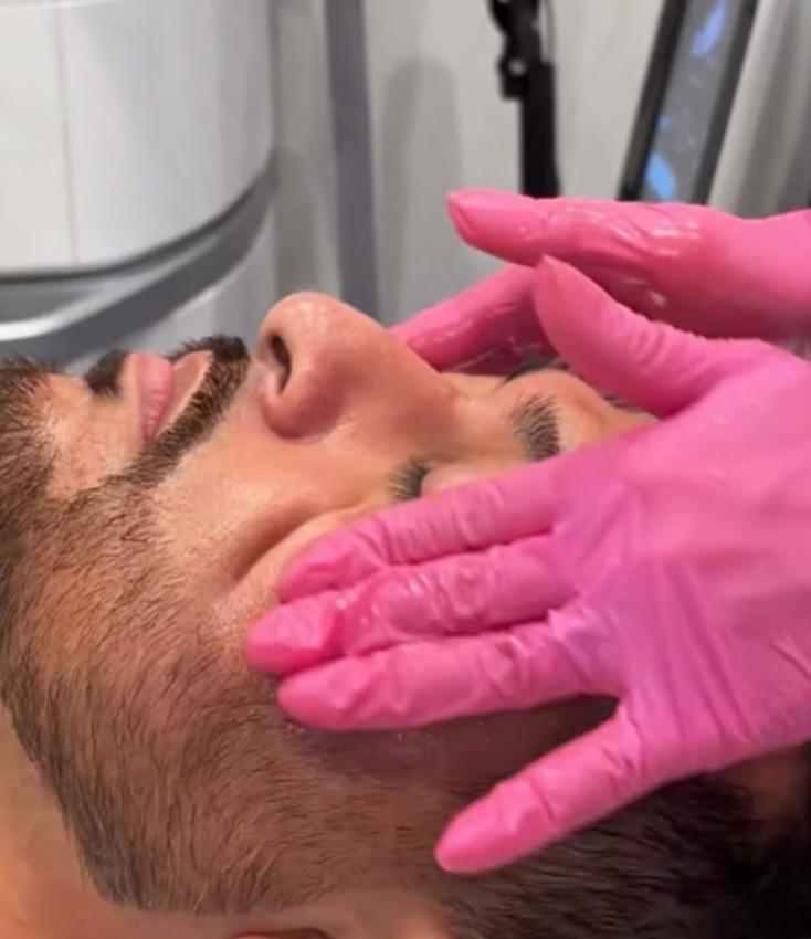 Aesthetic professional in a Southlake med spa treatment room during an aesthetic consultation.