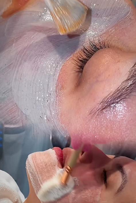 Close-up of a client receiving a hydrating facial mask applied with a brush at SVIT Aesthetics medical spa in Southlake Texas.