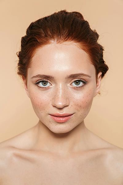 Woman with naturally glowing and hydrated skin following a Salmon DNA facial treatment at SVIT Aesthetics in Southlake Texas
