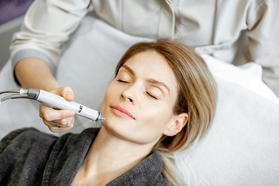 Aesthetic specialist performing a precision microneedling treatment on a client at SVIT Aesthetics in Southlake Texas