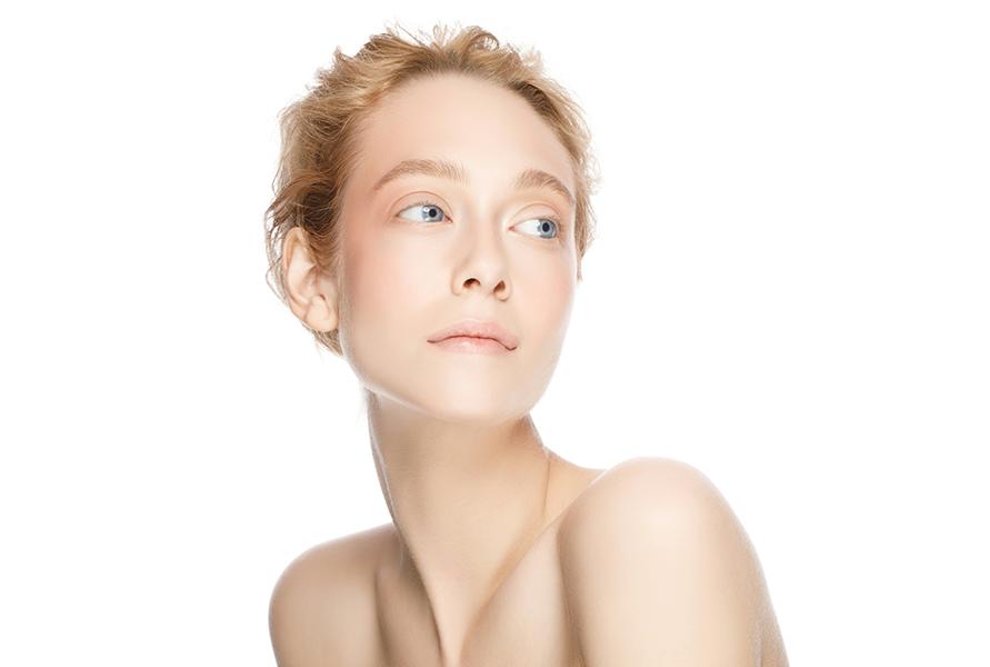 Woman with smooth, radiant skin across her face and neck following a Purasomes microneedling treatment at SVIT Aesthetics in Southlake Texas