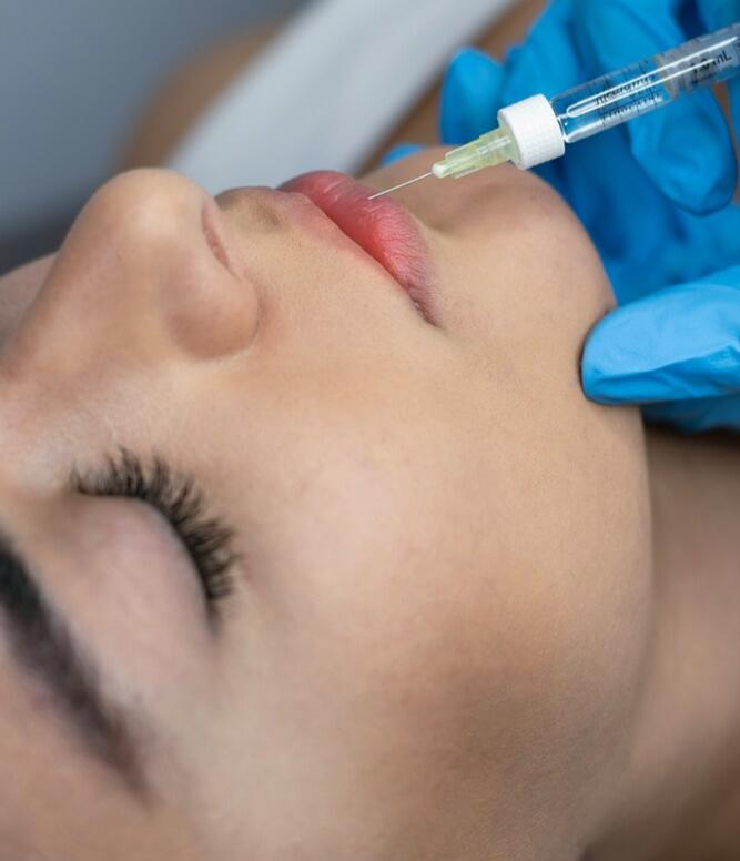 Medical professional performing precise lip filler injection at SVIT Aesthetics Southlake.