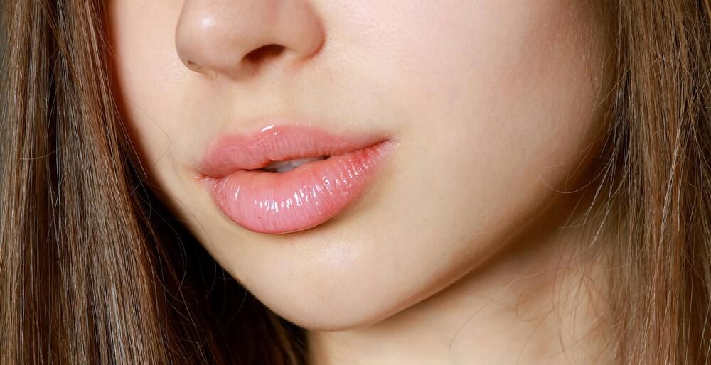 Natural lip enhancement results showing improved volume and hydration.