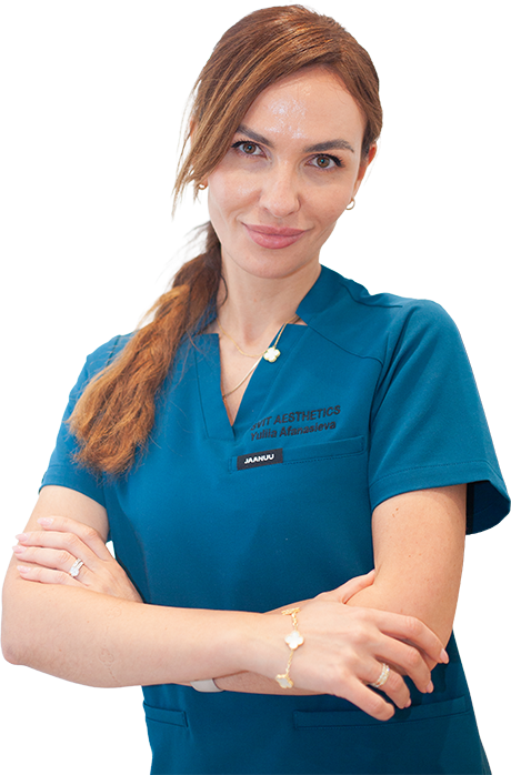 Aesthetics provider at SVIT Aesthetics in Southlake, TX, wearing teal scrubs in the clinic, specializing in skincare and facial treatments.