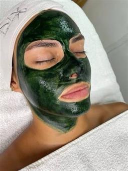 Medical aesthetician applying a superficial cosmetic peel to a client's face at SVIT Aesthetics in Southlake