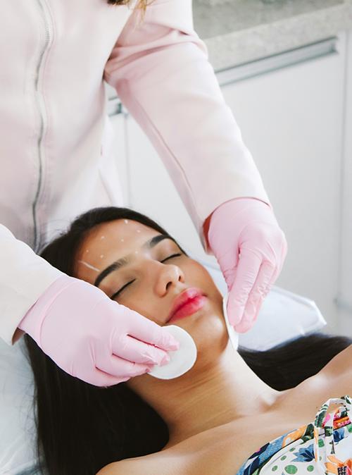 Woman enjoying a facial treatment, showcasing the refreshed and radiant results supported by skincare services at SVIT Aesthetics Southlake.