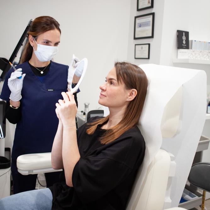 Client reviewing treatment options during a med spa membership consultation at SVIT Aesthetics in Southlake.