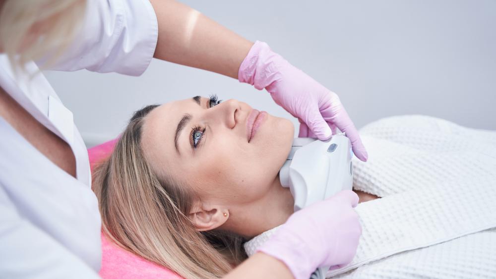 Client receiving a non-surgical skin tightening treatment for jawline and neck at SVIT Aesthetics.